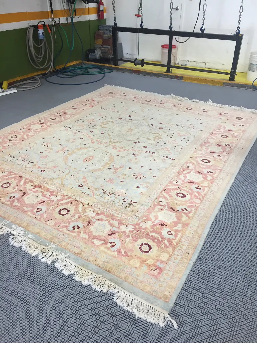 Clean intact fringe on a cream Persian rug