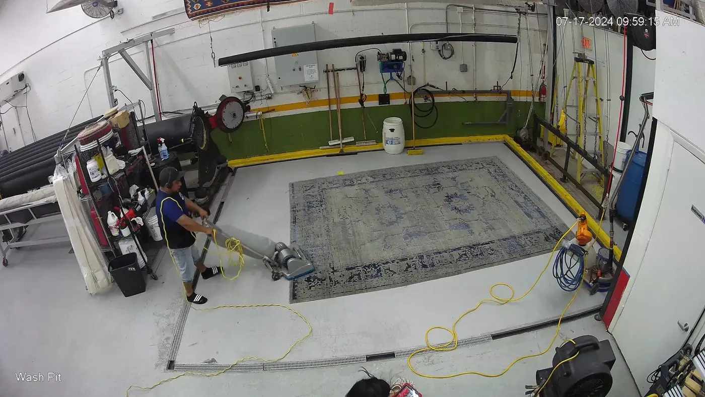 Rug laid in the wash pit at the plant